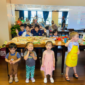 Kids make sandwiches for hungry